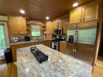 Fully equipped kitchen with gas range, microwave, dishwasher, refrigerator, Keurig K-Duo coffee maker and granite countertops 